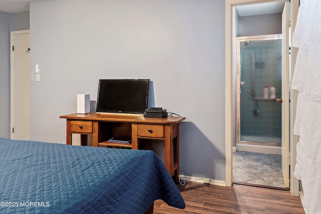 bedroom with dark hardwood / wood-style floors