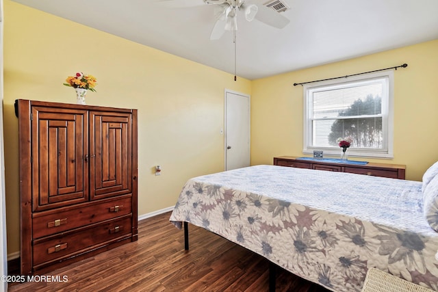 bedroom with ceiling fan and dark hardwood / wood-style floors