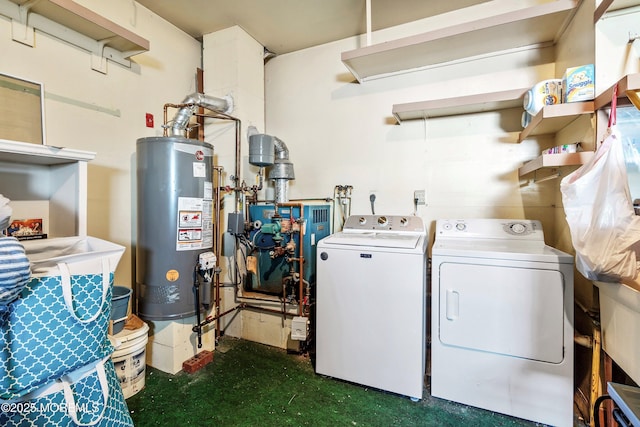 washroom with separate washer and dryer, water heater, and dark colored carpet