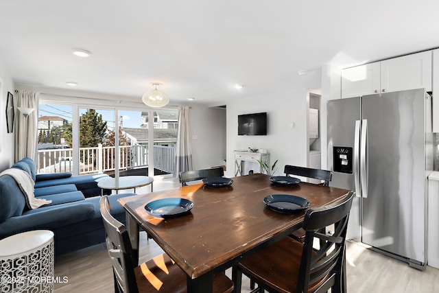 dining room with light hardwood / wood-style flooring