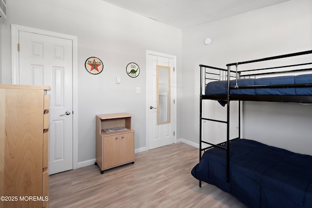 bedroom with light wood-type flooring