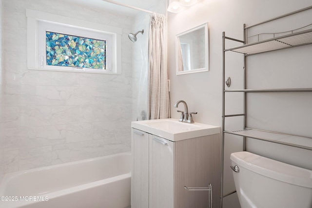 full bathroom with shower / bath combo, vanity, and toilet