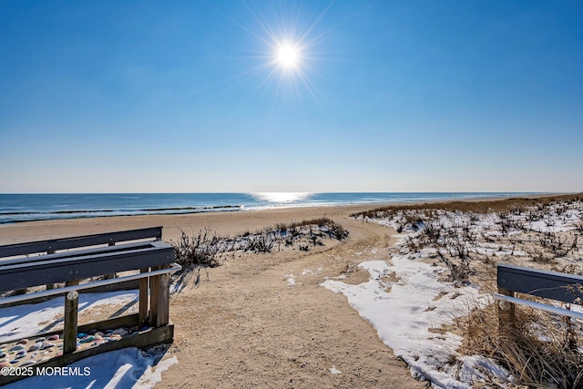 property view of water featuring a beach view