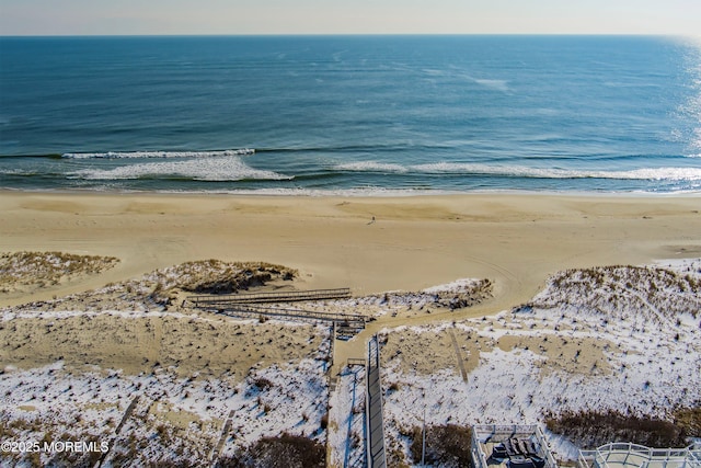 bird's eye view featuring a beach view and a water view