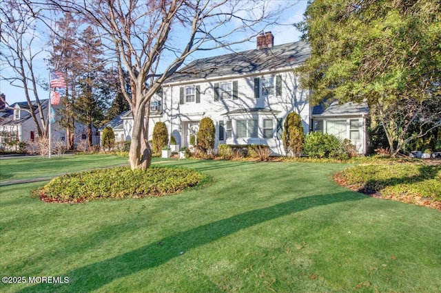 colonial home with a front yard