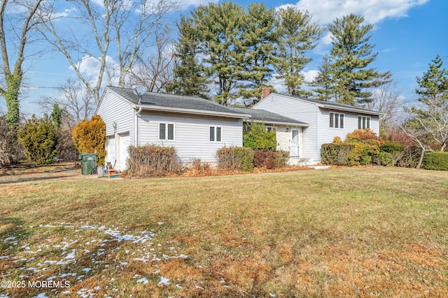 view of side of property with a yard