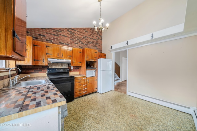 kitchen featuring white appliances, a baseboard heating unit, sink, hanging light fixtures, and tasteful backsplash