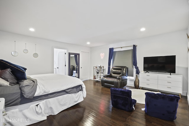 bedroom featuring dark hardwood / wood-style flooring