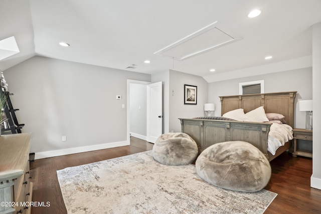 bedroom featuring dark hardwood / wood-style flooring and lofted ceiling