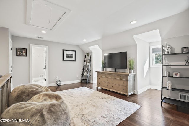 living room featuring dark hardwood / wood-style flooring and lofted ceiling