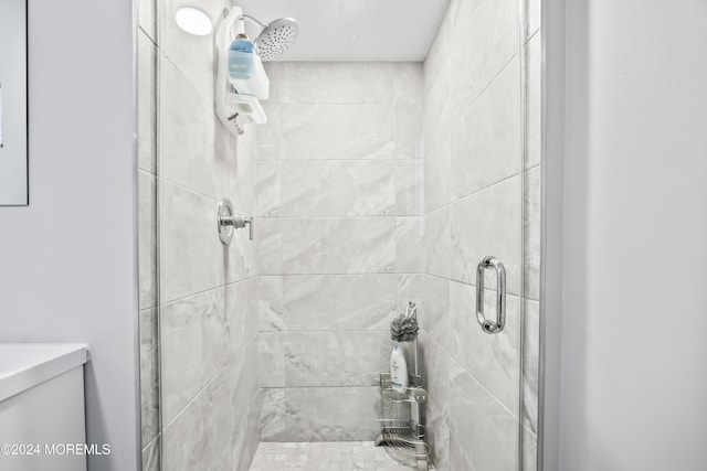 bathroom with a shower with door