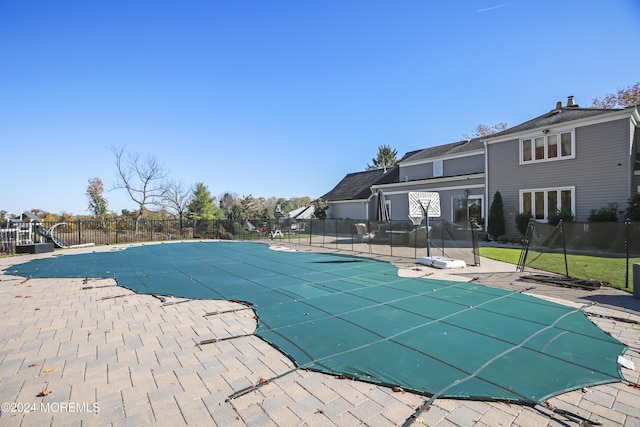 view of pool featuring a patio