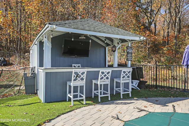 view of outdoor structure with an outdoor bar