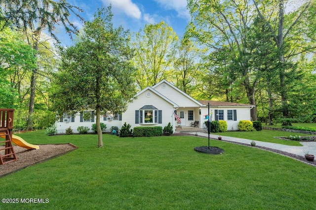 single story home featuring a playground and a front yard