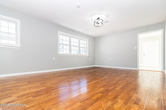 empty room with wood-type flooring