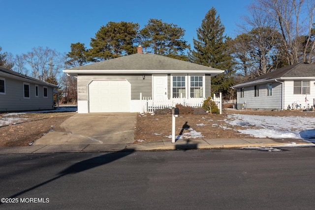 single story home featuring a garage