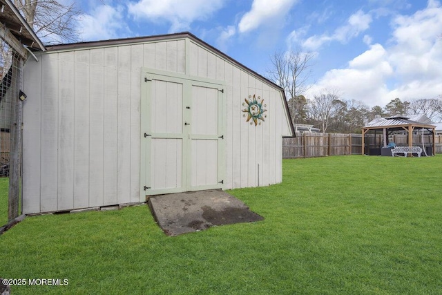 view of outbuilding featuring a gazebo and a yard