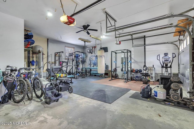 garage with ceiling fan and a garage door opener