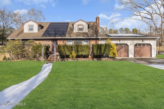 cape cod-style house with a garage, a front yard, and solar panels