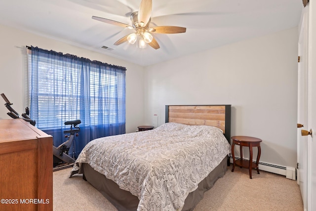 bedroom with a baseboard radiator, light carpet, and ceiling fan