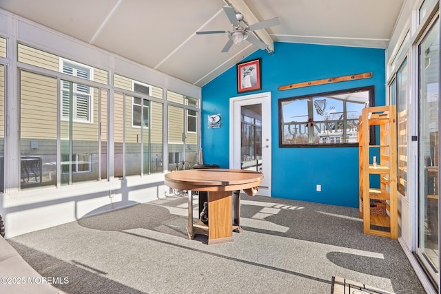 playroom featuring ceiling fan, lofted ceiling with beams, and carpet