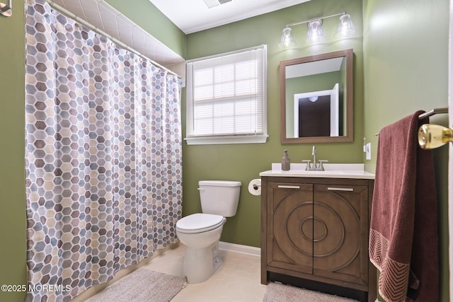 bathroom featuring toilet, a shower with shower curtain, vanity, and tile patterned floors