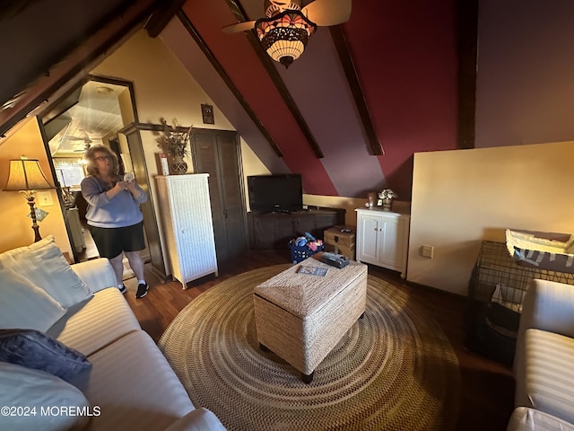 living room with vaulted ceiling with beams, ceiling fan, and dark wood-type flooring