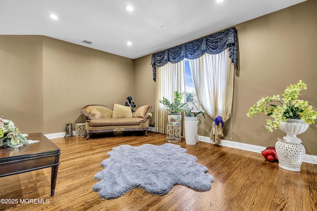 sitting room with hardwood / wood-style floors