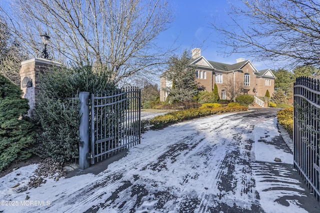 view of snow covered gate