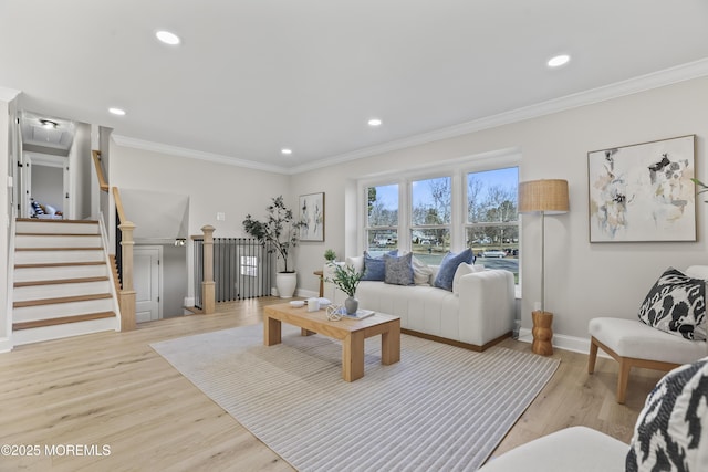 living room featuring light hardwood / wood-style floors and crown molding