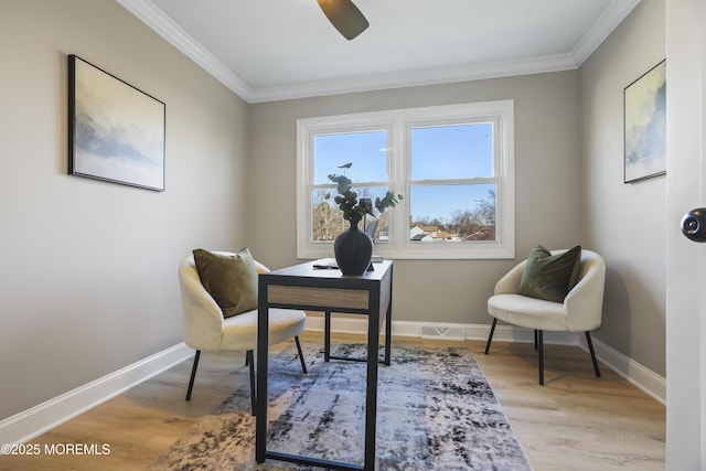 office area featuring ornamental molding, ceiling fan, and light hardwood / wood-style flooring