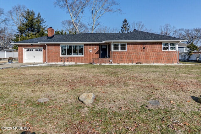 ranch-style home with a garage and a front lawn