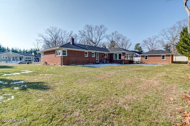 back of house featuring a yard and a patio