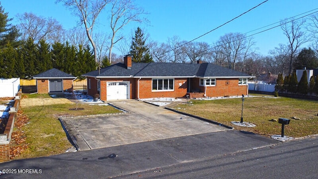 ranch-style home featuring a front lawn, a garage, and a storage shed