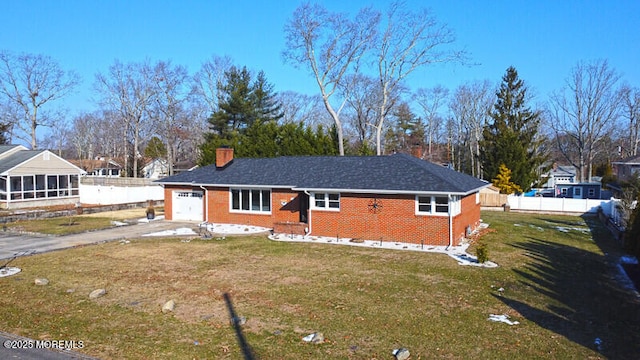 view of front facade with a front lawn and a garage