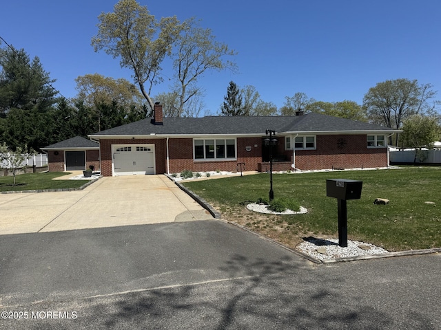 single story home featuring a chimney, brick siding, an attached garage, concrete driveway, and a front lawn