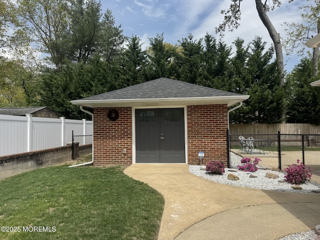 surrounding community featuring a fenced backyard, an outbuilding, and a lawn
