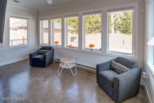 sunroom / solarium featuring plenty of natural light and a baseboard radiator