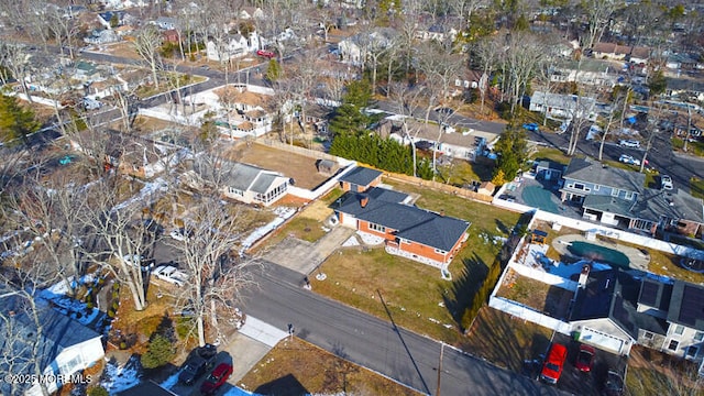 birds eye view of property with a residential view