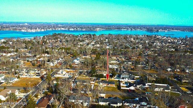 bird's eye view featuring a water view and a residential view