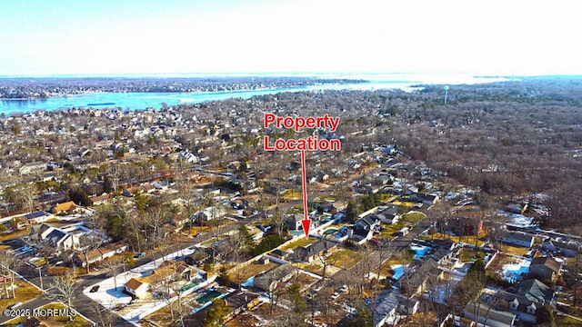 birds eye view of property with a residential view