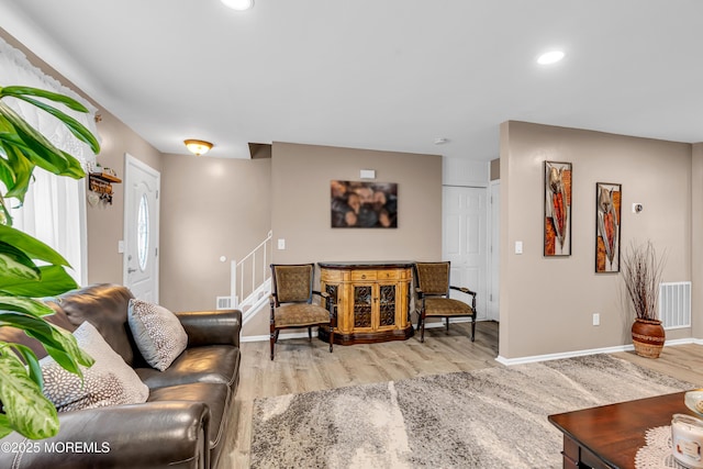 living room with light hardwood / wood-style flooring