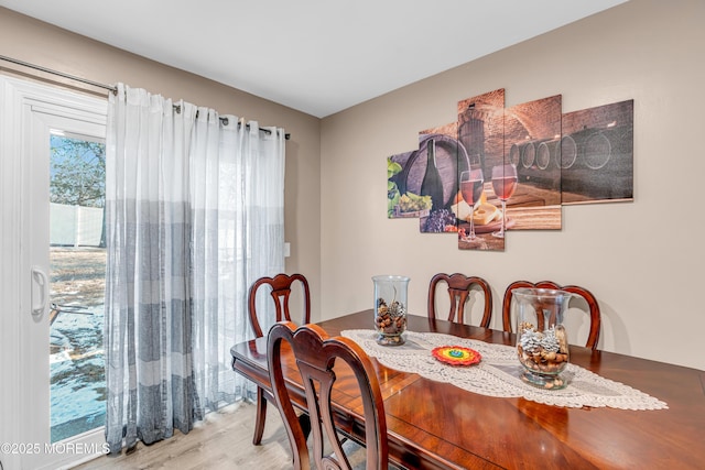 dining room with hardwood / wood-style flooring