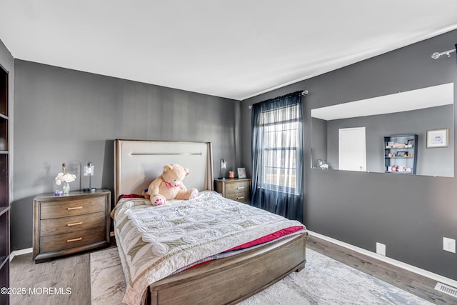 bedroom featuring wood-type flooring