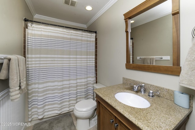 bathroom featuring ornamental molding, vanity, and toilet