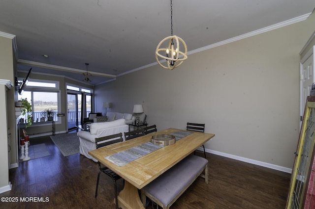 dining space featuring an inviting chandelier, ornamental molding, and dark wood-type flooring