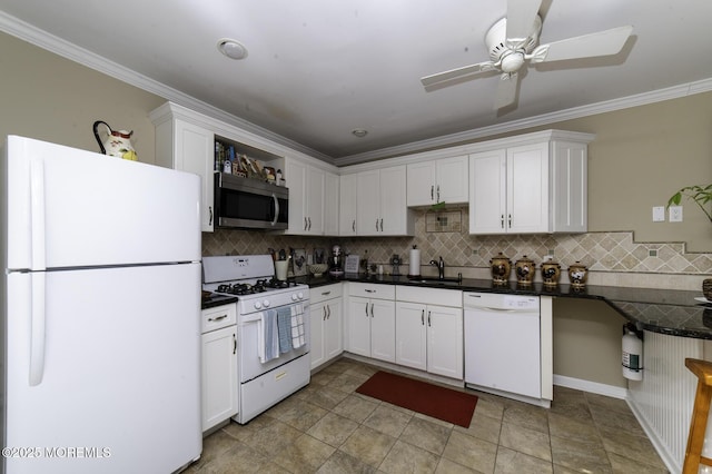 kitchen featuring white appliances, ornamental molding, sink, white cabinetry, and backsplash