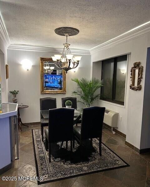 dining room with a textured ceiling, ornamental molding, and a notable chandelier