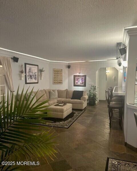 living room with a textured ceiling