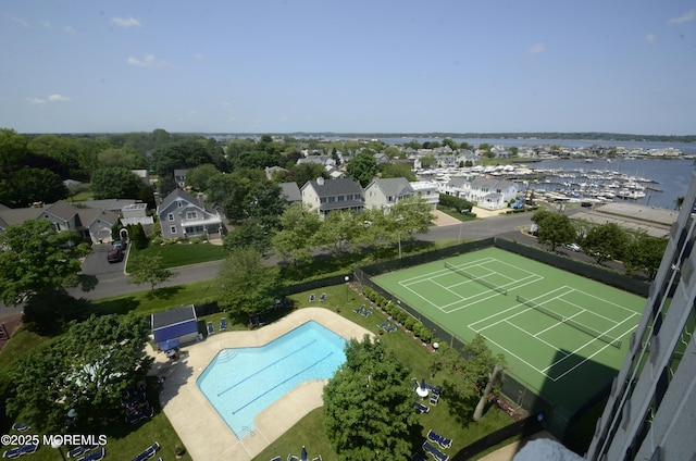 birds eye view of property with a water view